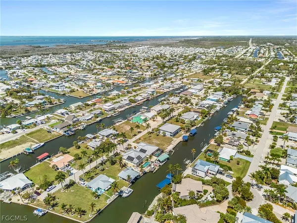 an aerial view of residential building and ocean