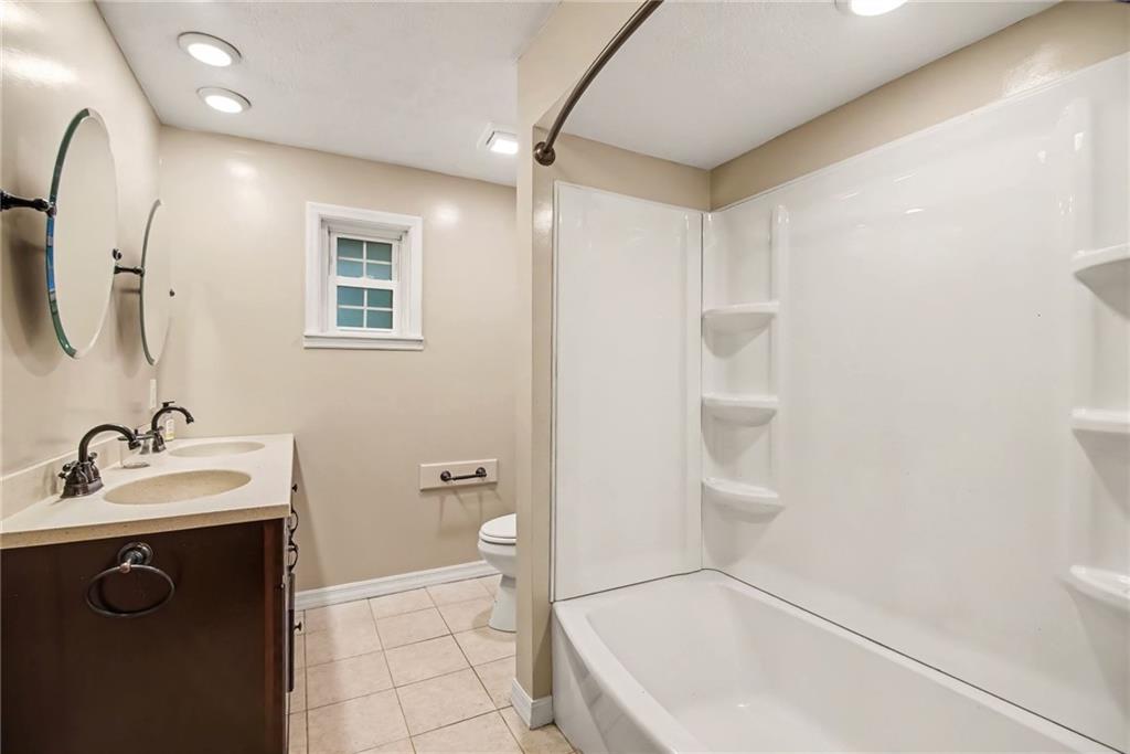 330 Butler Road Saxonburg, PA 16056 - Photo 12 of 28 a bathroom with a sink a toilet and shower