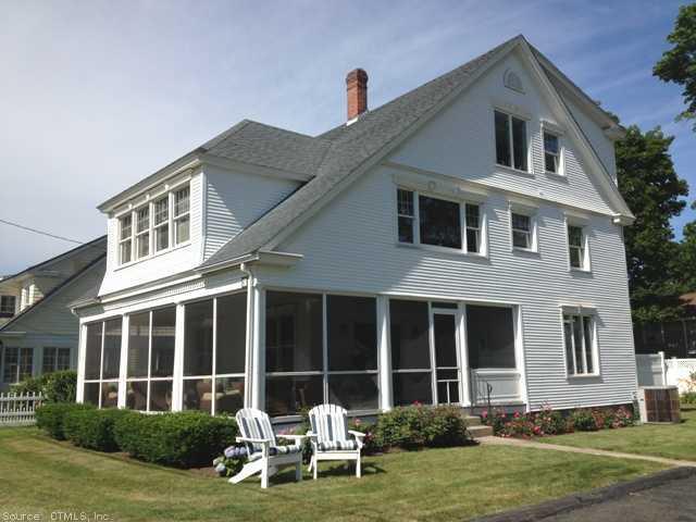 41 Grove Avenue Madison, CT 06443 - Photo 1 of 1 a front view of a house with a yard and garage