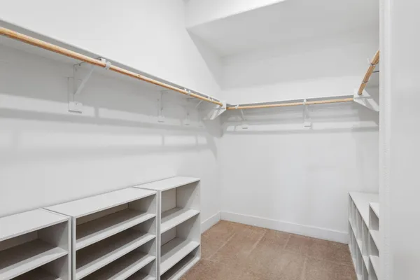 a view of an empty walk in closet