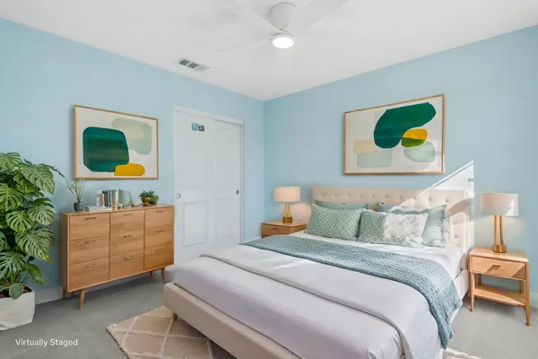 a bedroom with a bed and furniture