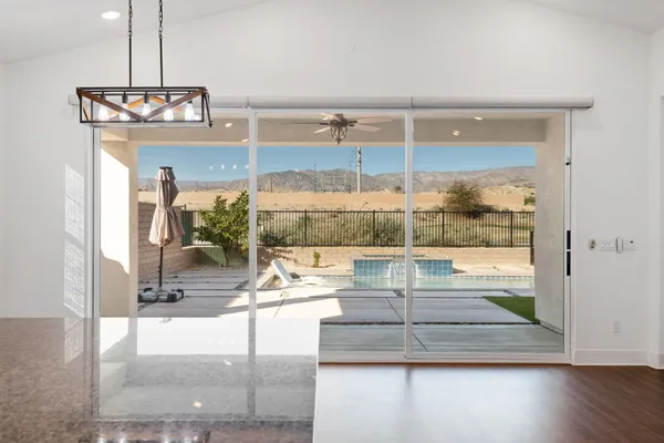a room with view of living room and chandelier