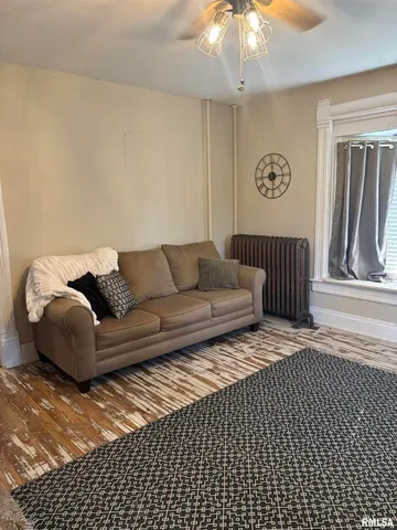 a bedroom with a bed and a mirror