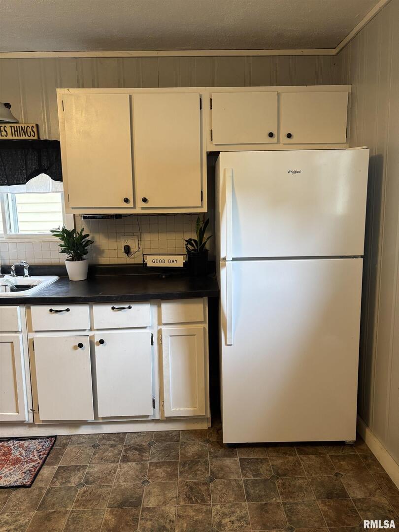 417 Northeast 2nd Avenue Galva, IL 61434 - Photo 34 of 62 a white refrigerator freezer sitting in a kitchen