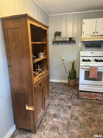 a bed sitting in a bedroom with a bed