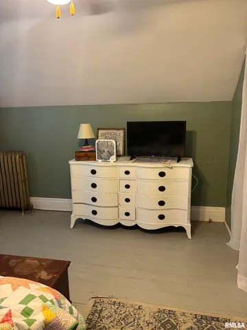 a view of a room with furniture and a window