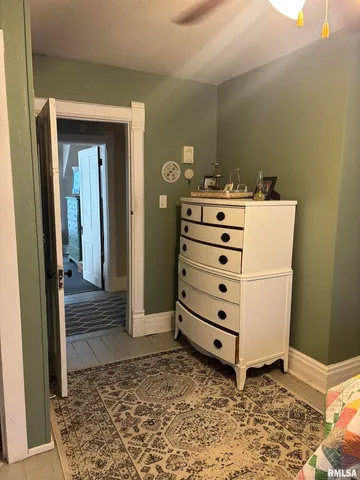 a view of an empty room with wooden walls