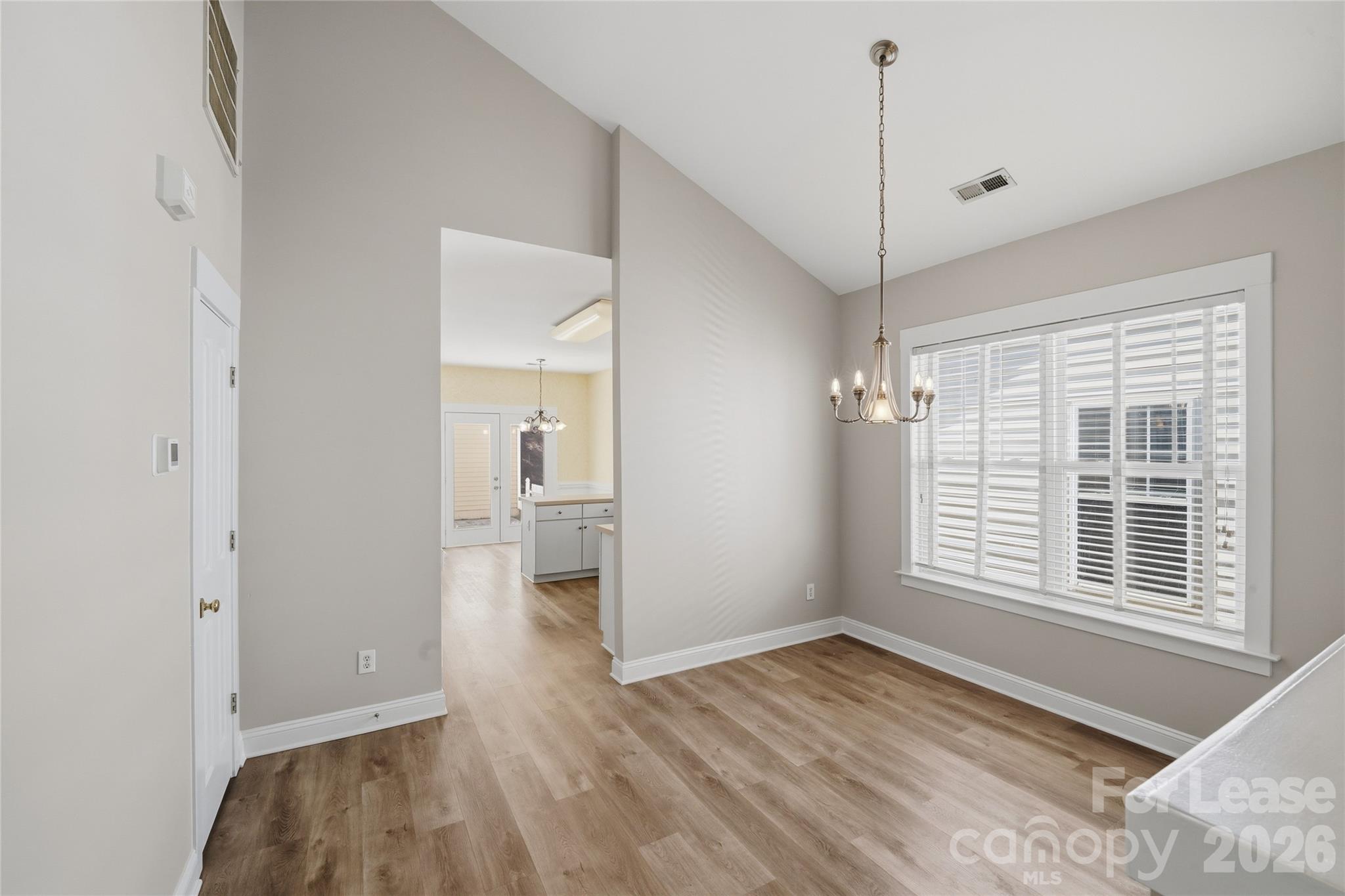11355 Deer Ridge Lane Charlotte, NC 28277 - Photo 9 of 32 a view of a room with a window and wooden floor
