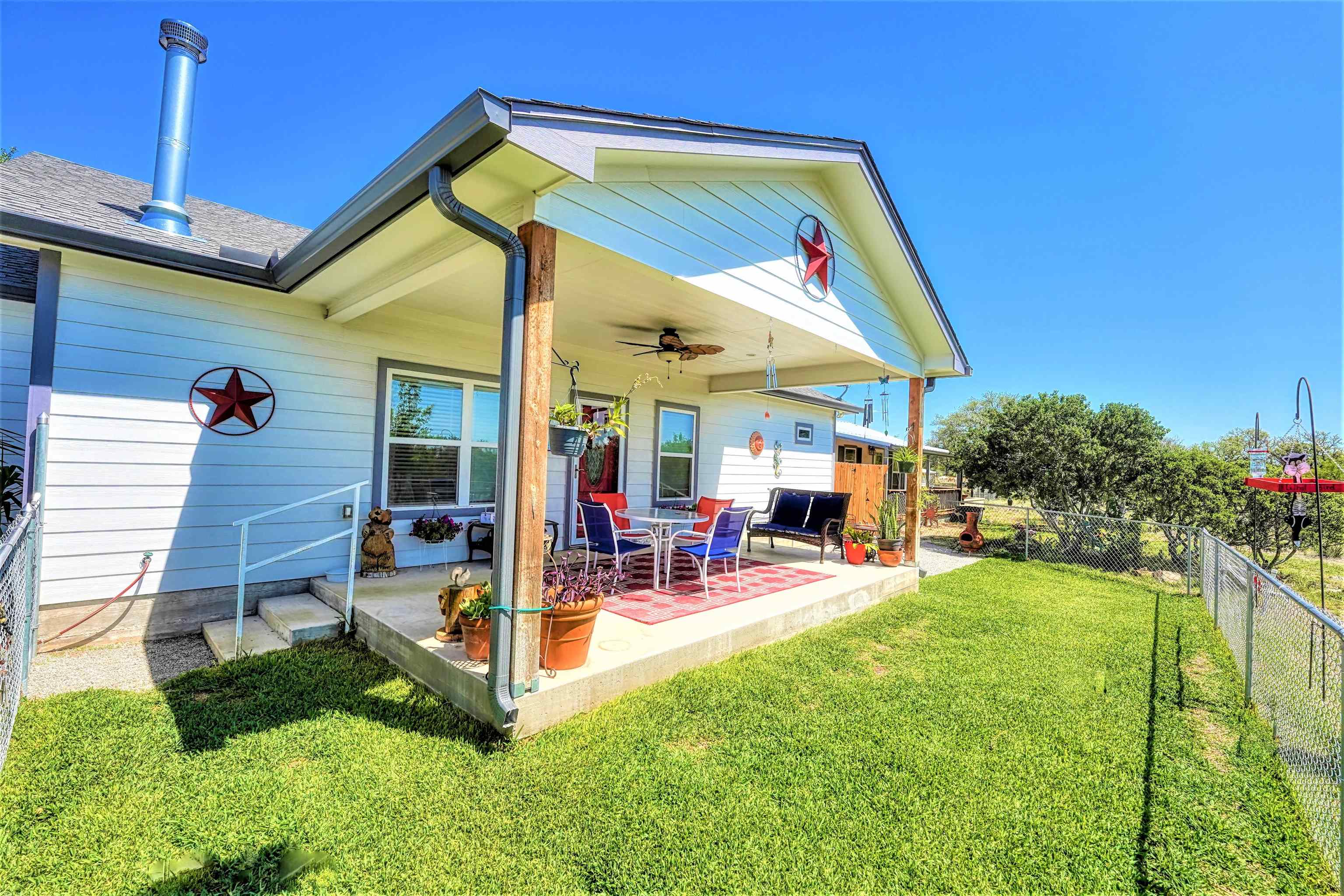 202 Rio Llano Drive West Llano, TX 78643 - Photo 1 of 1 a view of a house with backyard and porch
