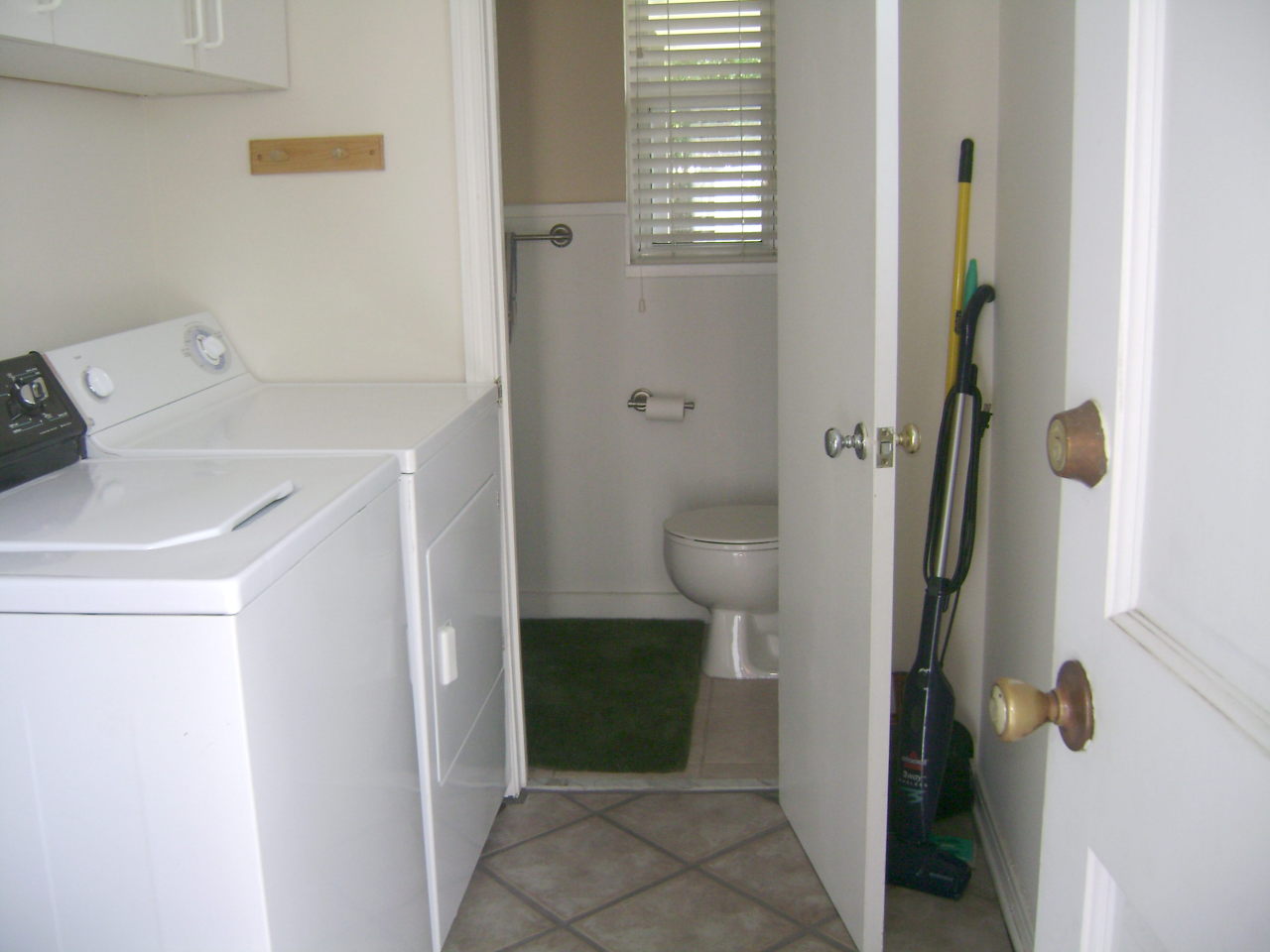 1165 Nicholson Road Jacksonville, FL 32207 - Photo 10 of 22 a bathroom with a sink and toilet