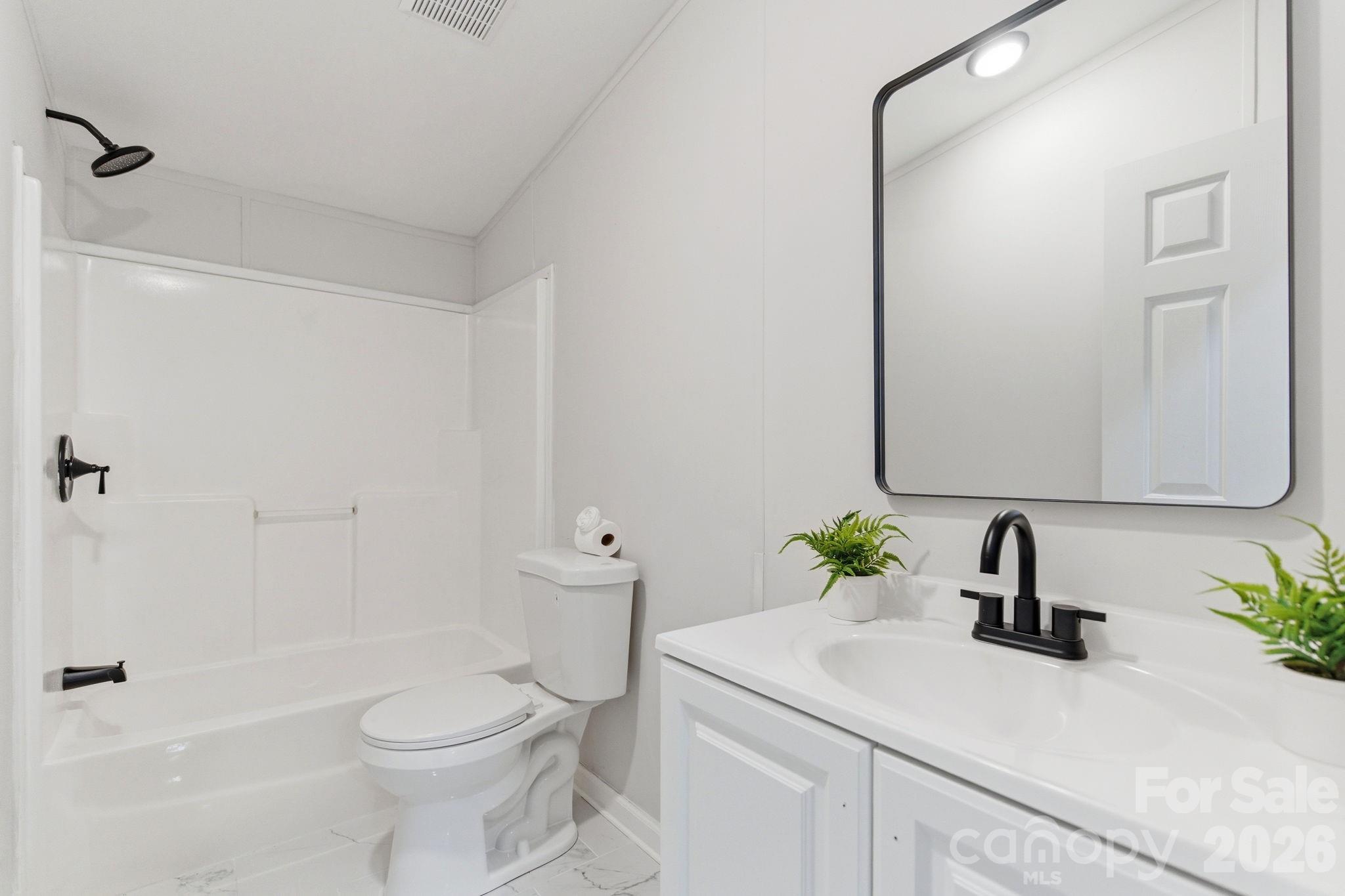 481 Harrell Road Burgaw, NC 28425 - Photo 16 of 25 a bathroom with a sink a toilet and shower