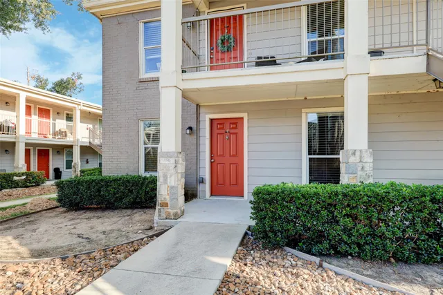 a view of a building with a yard