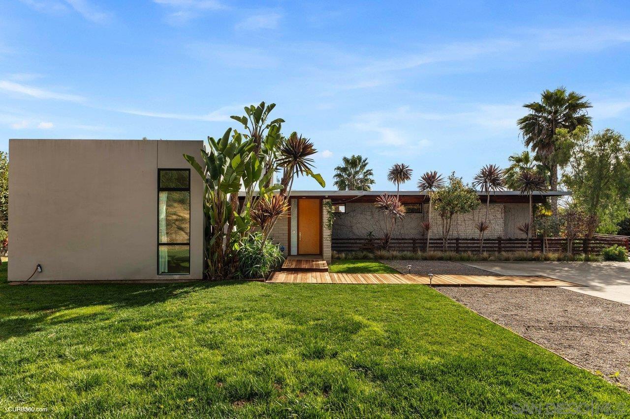 3545 Dove Hollow Road Encinitas, CA 92024 - Photo 11 of 69 a view of a house with a yard and a tree