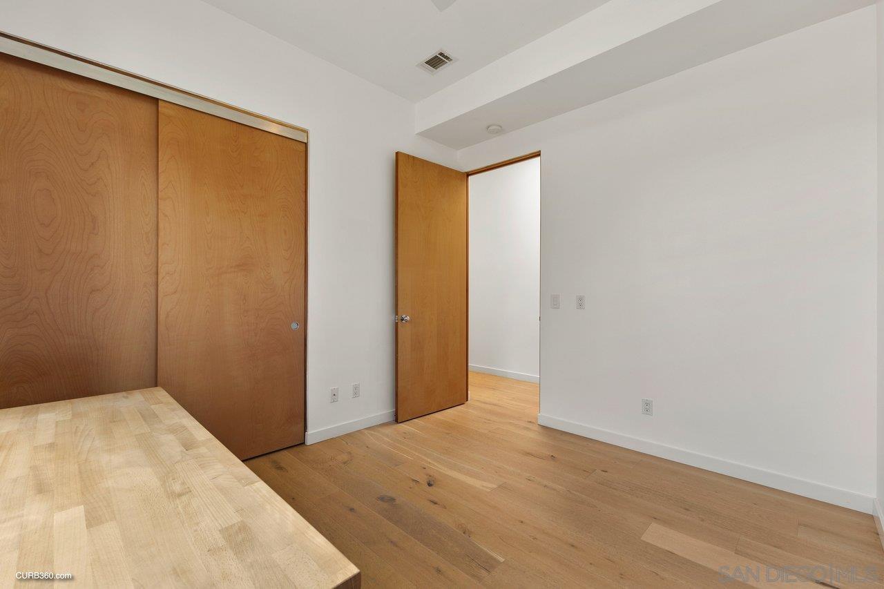 3545 Dove Hollow Road Encinitas, CA 92024 - Photo 39 of 69 a view of a room with wooden floor and closet