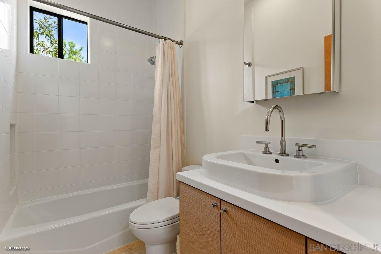 3545 Dove Hollow Road Encinitas, CA 92024 - Photo 41 of 69 a bathroom with a sink a toilet and shower