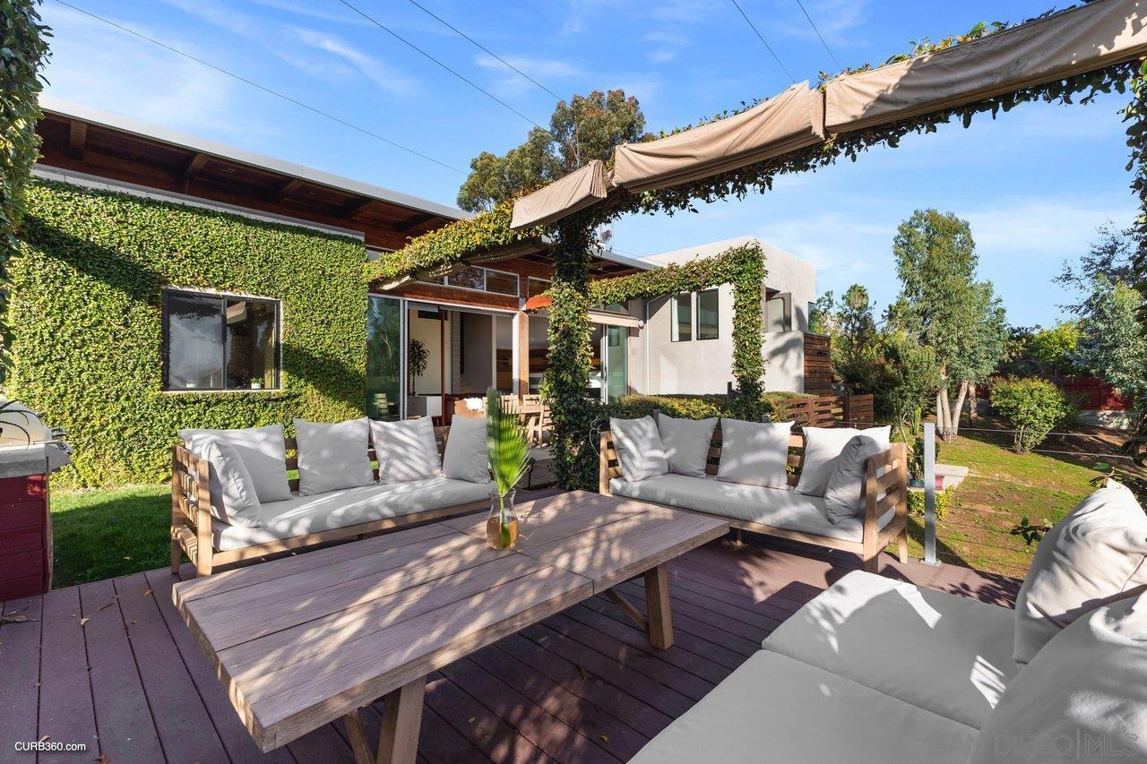 3545 Dove Hollow Road Encinitas, CA 92024 - Photo 48 of 69 a view of a patio with couches table and chairs and potted plants