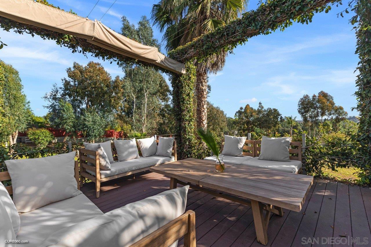 3545 Dove Hollow Road Encinitas, CA 92024 - Photo 49 of 69 a view of a terrace with couches and wooden floor