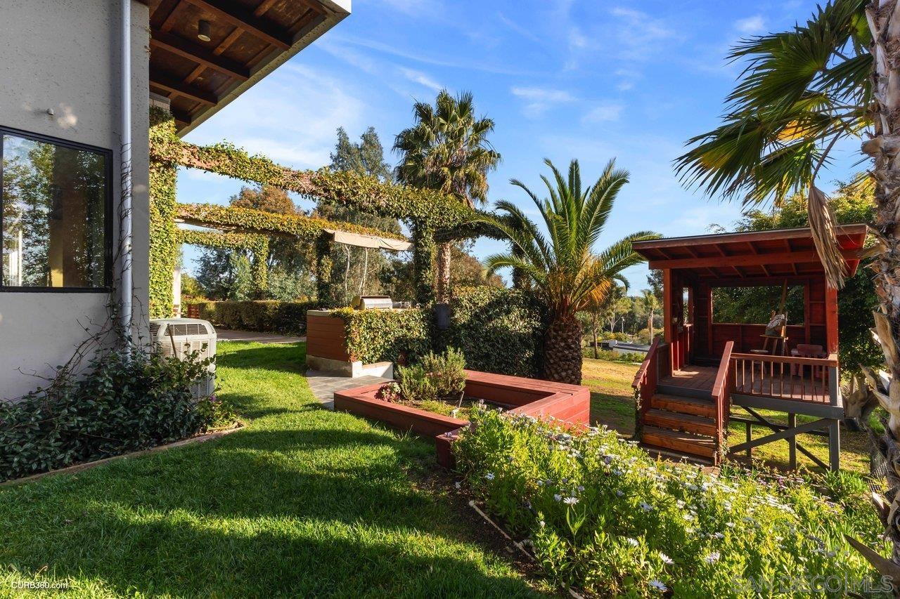 3545 Dove Hollow Road Encinitas, CA 92024 - Photo 54 of 69 a view of a backyard with plants and a patio