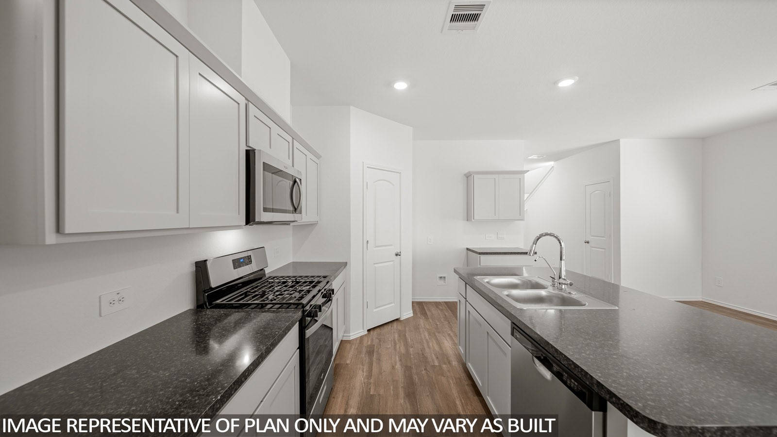 125 Rising Cedar Lane Hockley, TX 77447 - Photo 4 of 19 a kitchen with stainless steel appliances granite countertop a sink a stove counter space and cabinets