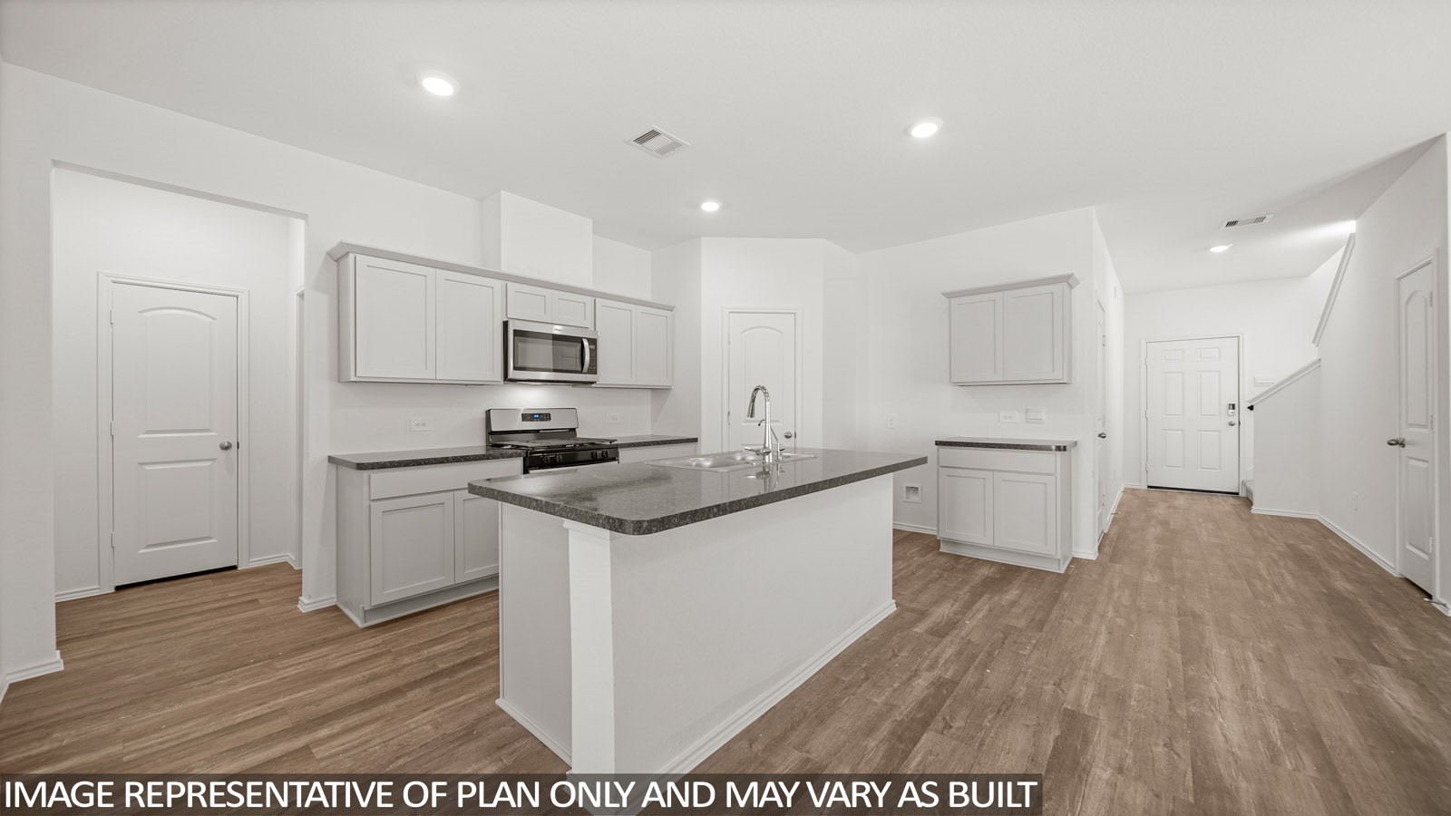 125 Rising Cedar Lane Hockley, TX 77447 - Photo 5 of 19 a kitchen with a sink microwave and refrigerator