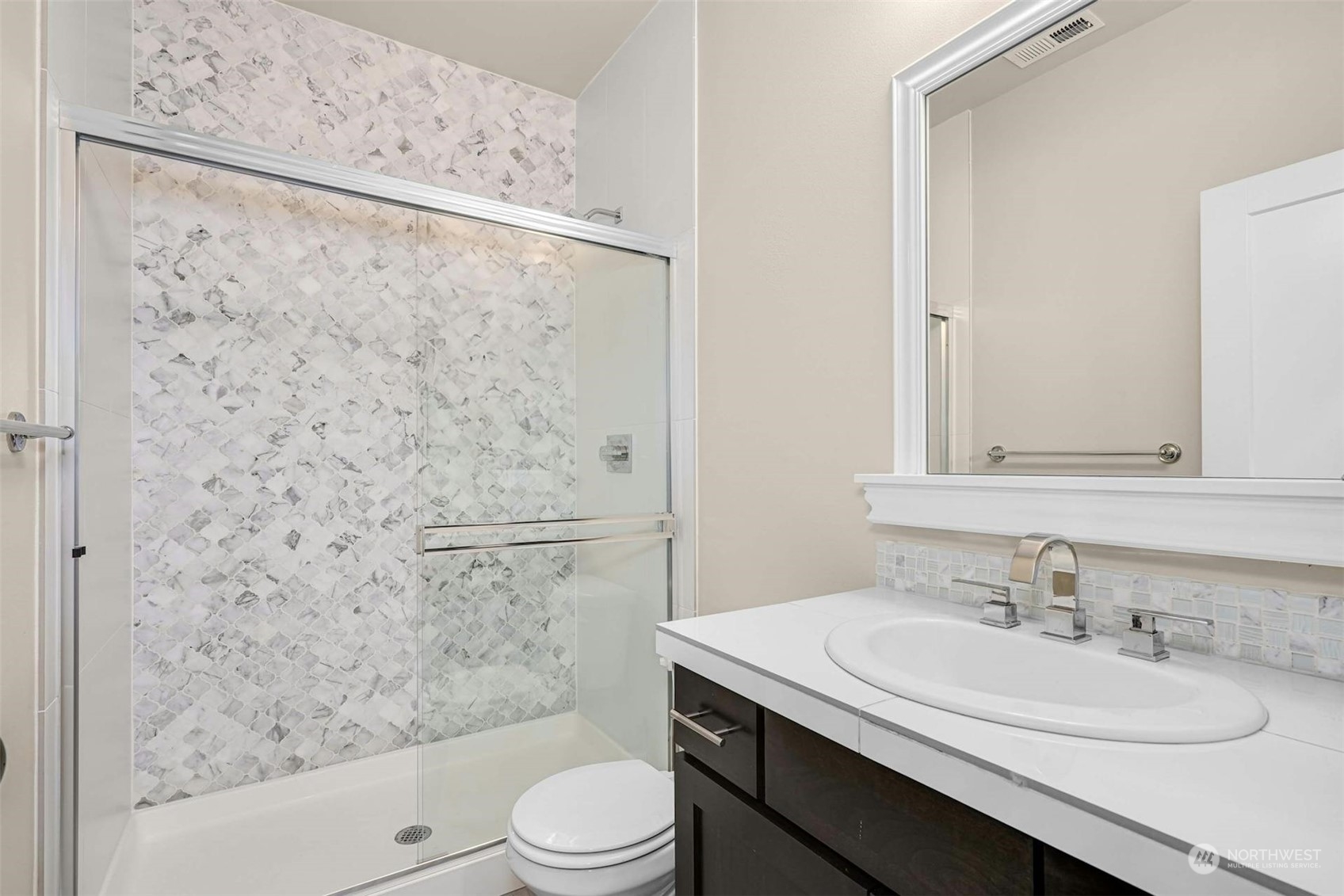 19042 84th Place Northeast Bothell, WA 98011 - Photo 19 of 40 a bathroom with a granite countertop sink toilet and shower