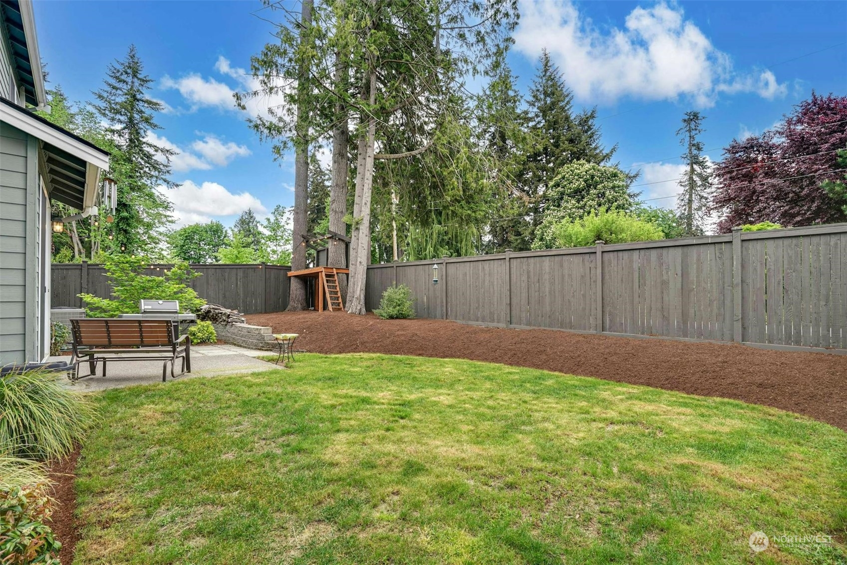 19042 84th Place Northeast Bothell, WA 98011 - Photo 34 of 40 a view of a backyard with a garden and seating area