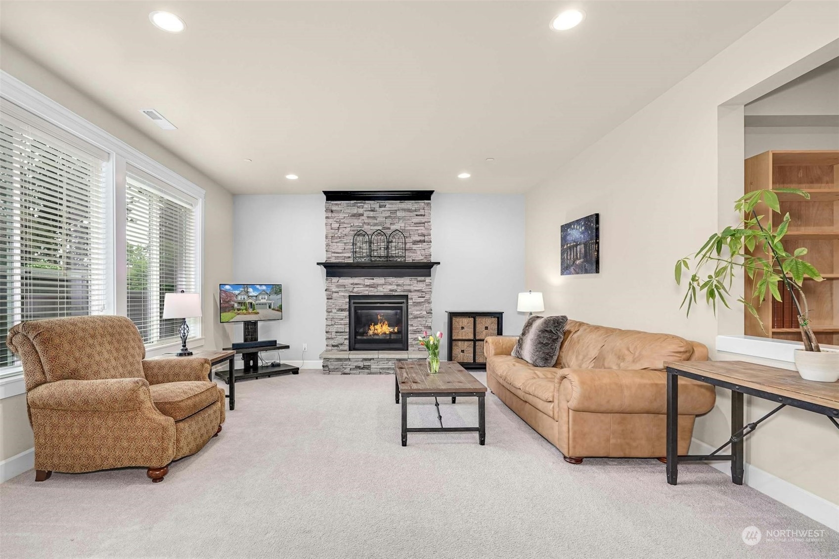19042 84th Place Northeast Bothell, WA 98011 - Photo 7 of 40 a living room with furniture and a fireplace