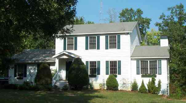 1018 Durrett Ridge Road Earlysville, VA 22936 - Photo 1 of 4 a front view of a house with a yard