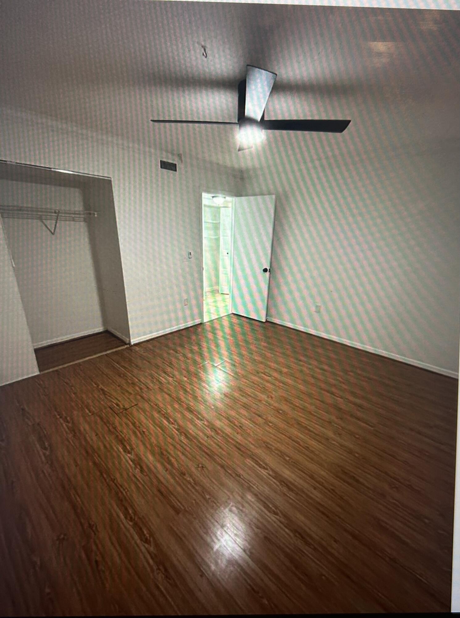 650 Southwest 2nd Avenue, Unit 2490 Boca Raton, FL 33432 - Photo 11 of 18 a view of an empty room with wooden floor