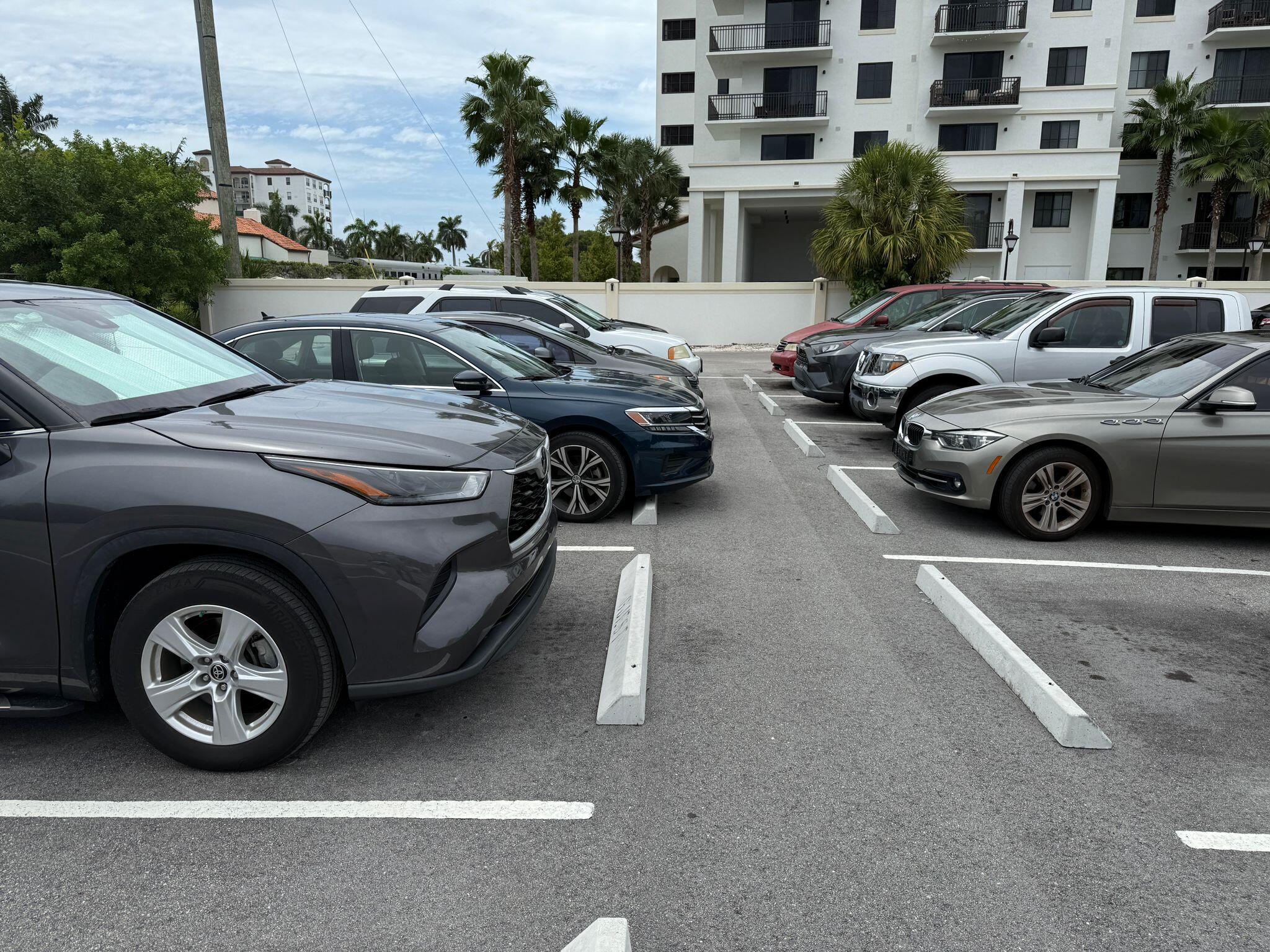 650 Southwest 2nd Avenue, Unit 2490 Boca Raton, FL 33432 - Photo 16 of 18 a view of a car parked in front of a building