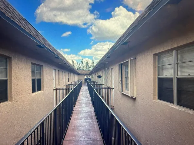 a view of a house with wooden stairs