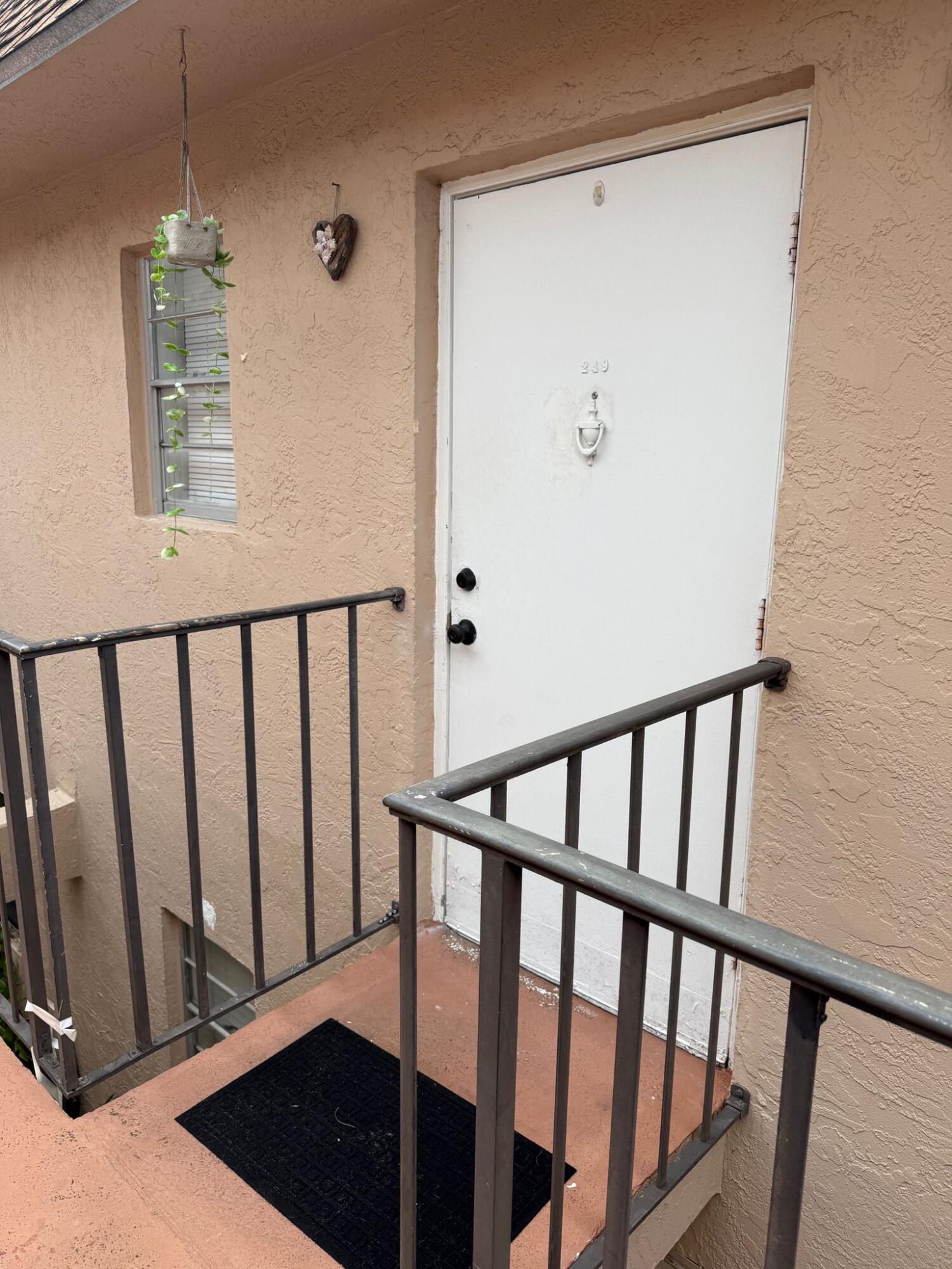 650 Southwest 2nd Avenue, Unit 2490 Boca Raton, FL 33432 - Photo 3 of 18 a view of a hallway with windows