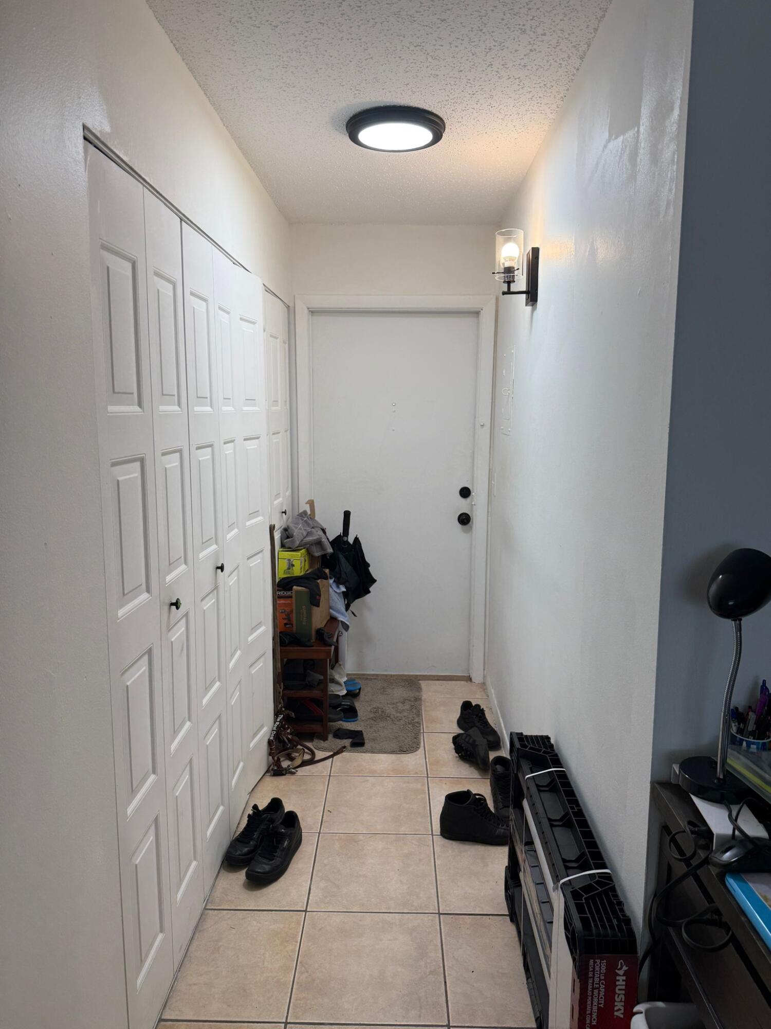 650 Southwest 2nd Avenue, Unit 2490 Boca Raton, FL 33432 - Photo 4 of 18 a room with lots of white furniture