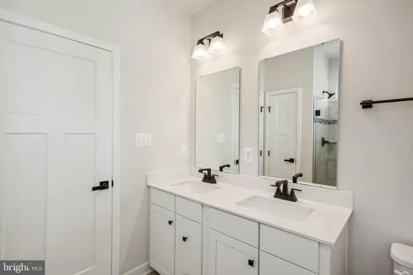 a bathroom with a glass shower door