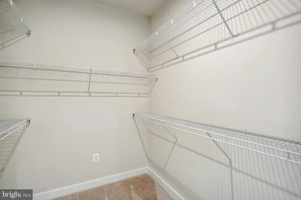 a view of a room with racks on the wall