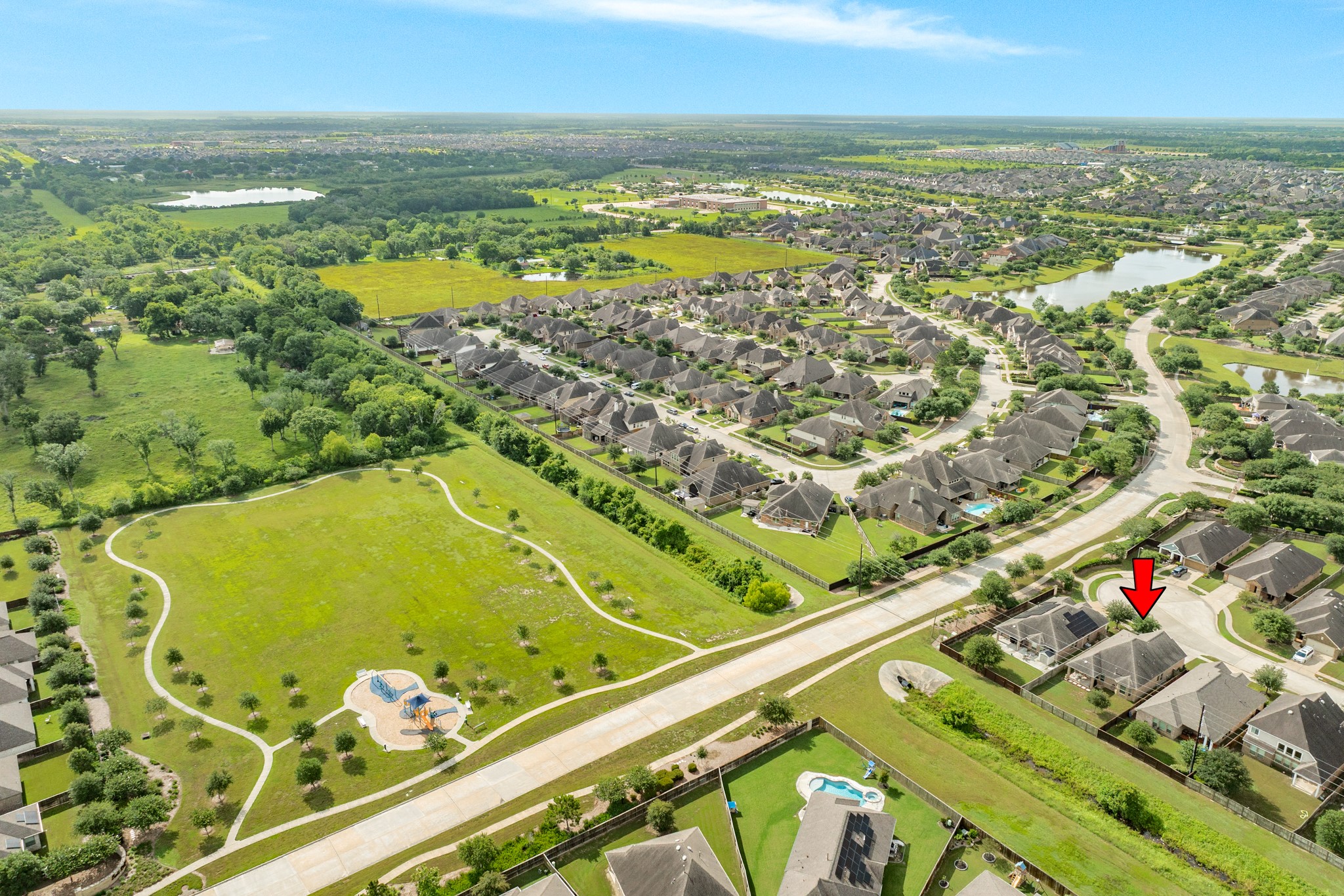 3519 Bay Drive Rosharon, TX 77583 - Photo 35 of 49 Spacious wide-angle view of the Meridiana community featuring expansive landscaping and architectural detail.