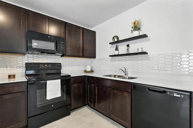 a kitchen with a refrigerator and a microwave