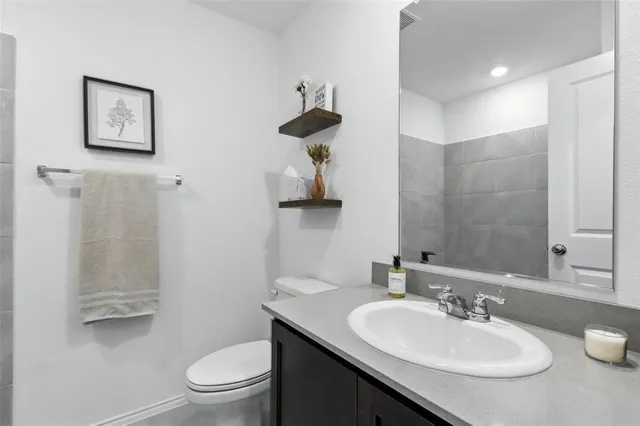 a bathroom with a tub and shower