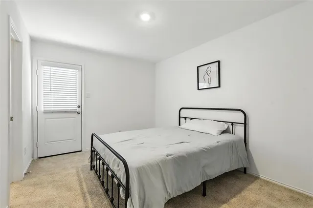 a bedroom with a bed and a walk in closet