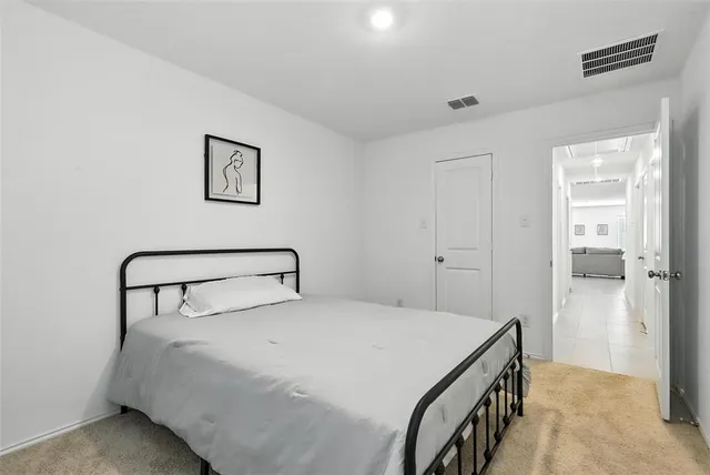 a bedroom with a bed and a cabinets