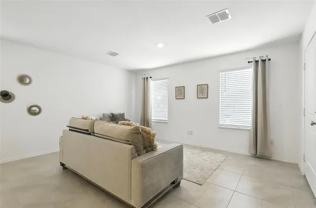 a living room with furniture and a couch