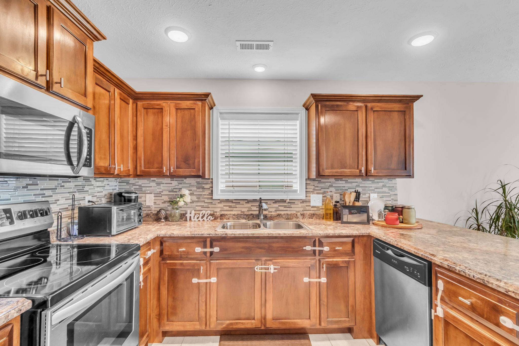 4624 Springstead Trail Antioch, TN 37013 - Photo 11 of 21 a kitchen with a sink stove and cabinets
