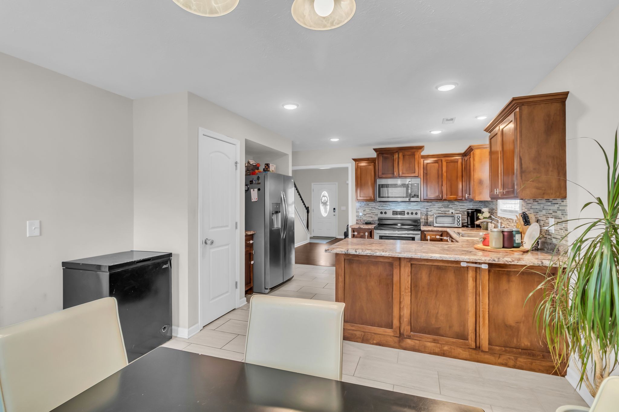 4624 Springstead Trail Antioch, TN 37013 - Photo 13 of 21 a large kitchen with stainless steel appliances granite countertop a stove a sink dishwasher and a refrigerator