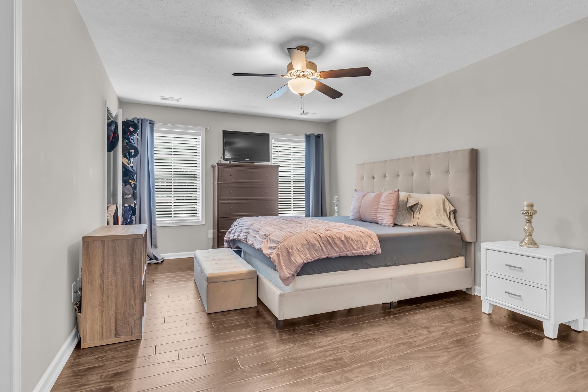 4624 Springstead Trail Antioch, TN 37013 - Photo 15 of 21 a bedroom with a large bed and a chandelier