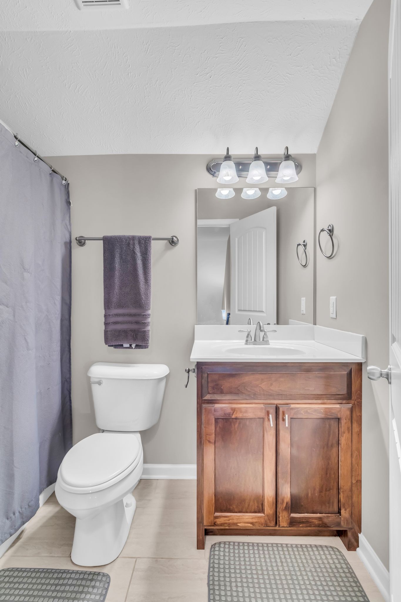 4624 Springstead Trail Antioch, TN 37013 - Photo 19 of 21 a bathroom with a granite countertop toilet a sink and a mirror
