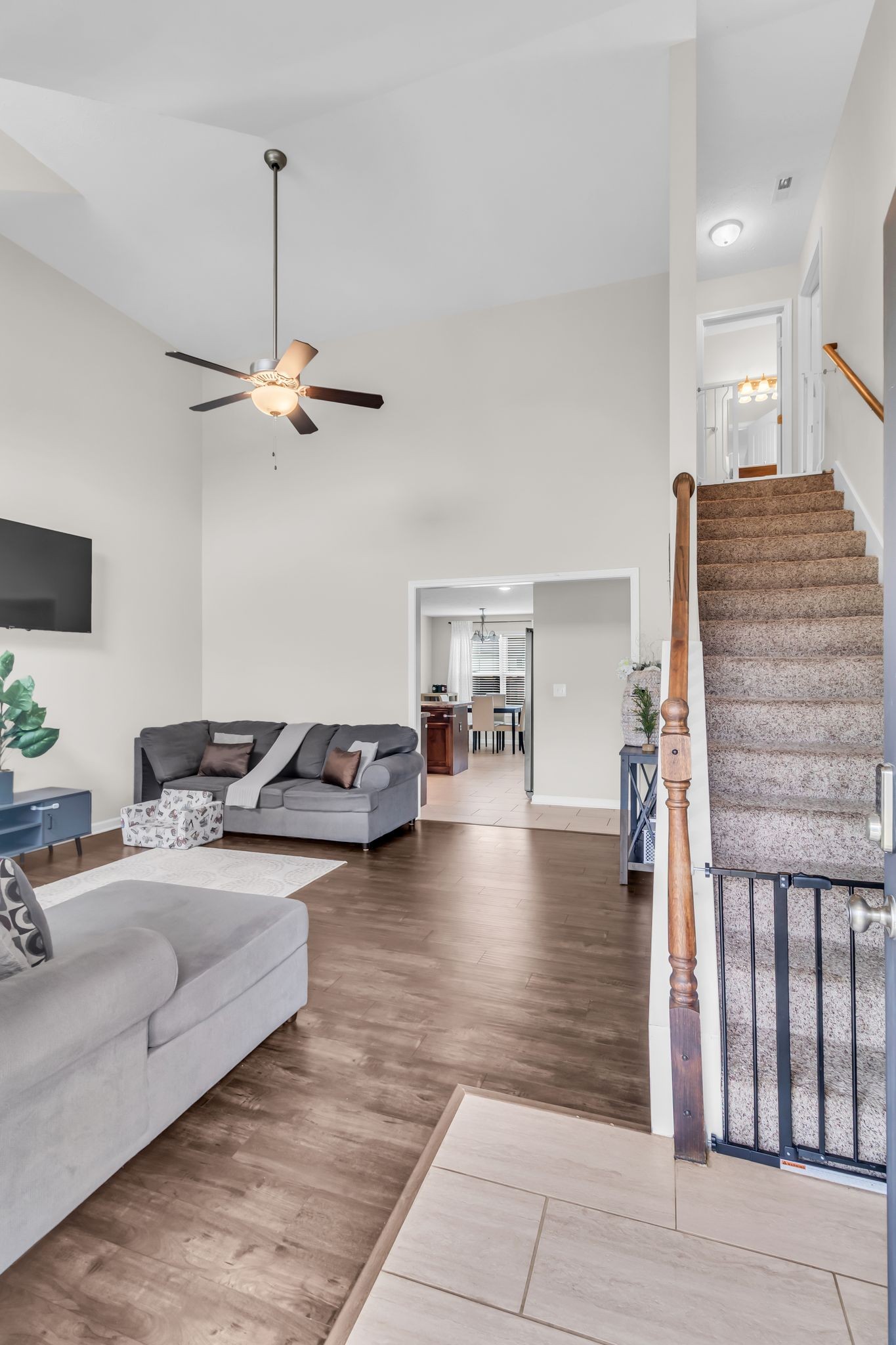 4624 Springstead Trail Antioch, TN 37013 - Photo 4 of 21 a living room with furniture and a chandelier