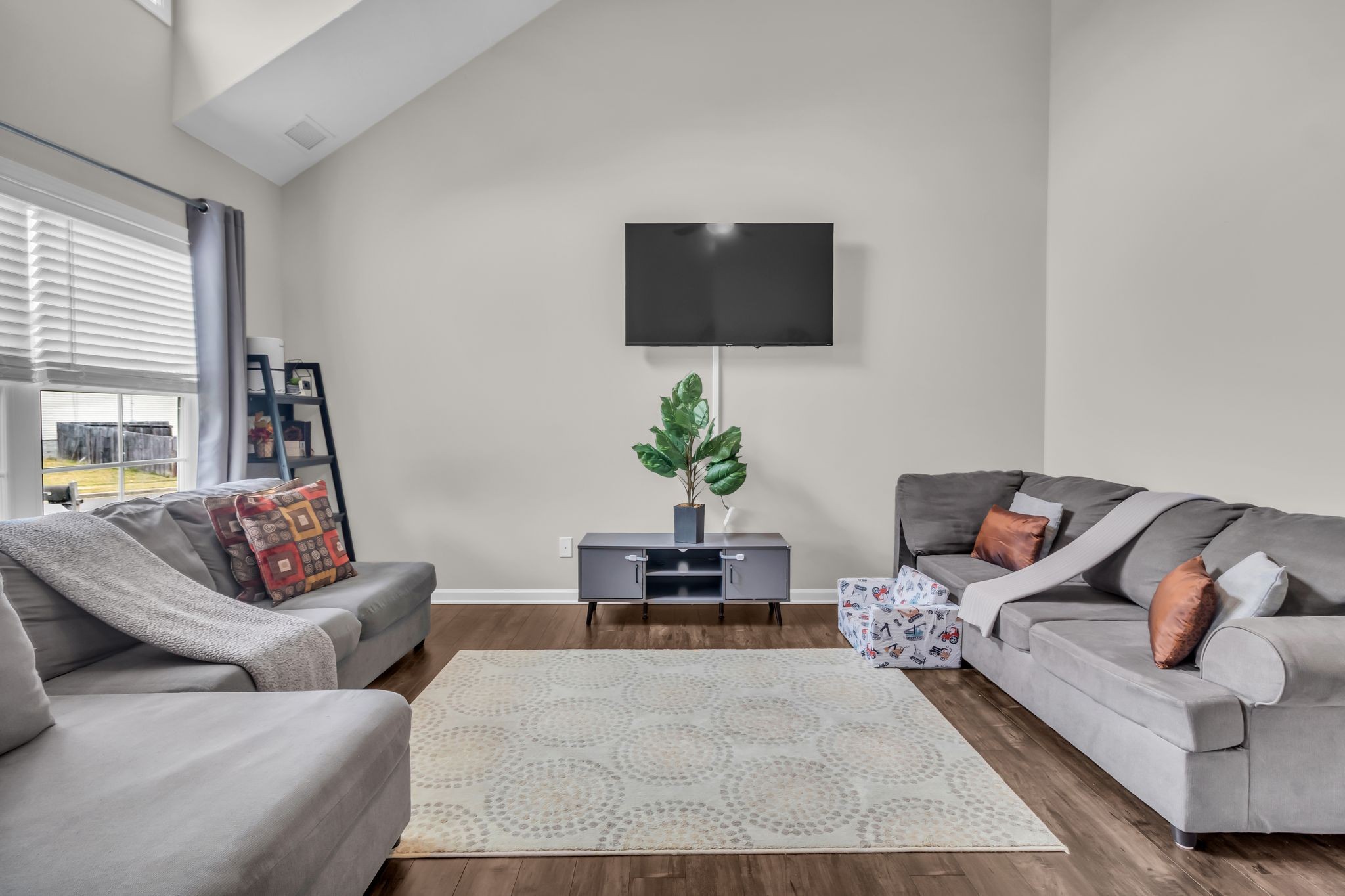 4624 Springstead Trail Antioch, TN 37013 - Photo 8 of 21 a living room with furniture and a flat screen tv