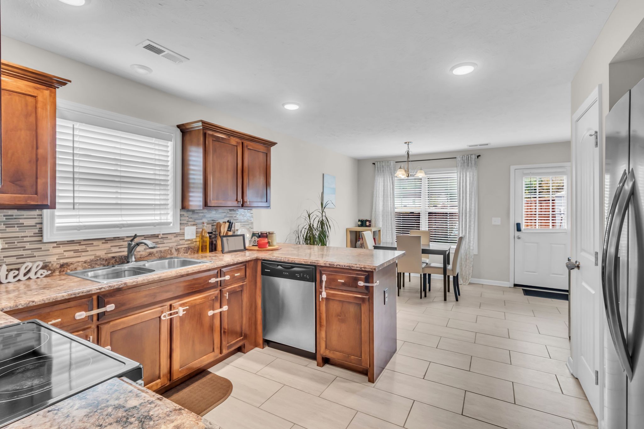 4624 Springstead Trail Antioch, TN 37013 - Photo 9 of 21 a kitchen with a sink and chairs