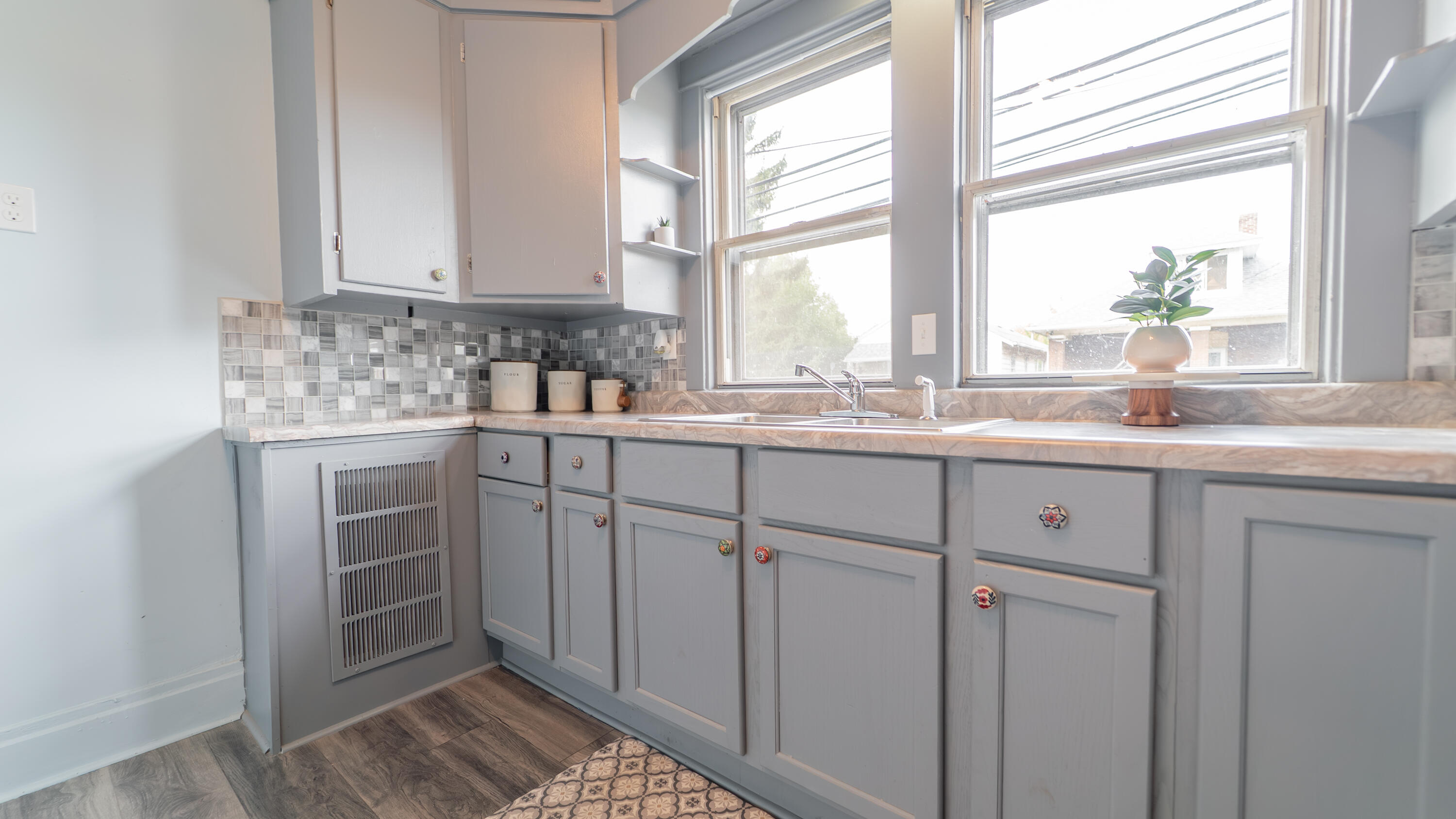 1916 Wespark Avenue Whiting, IN 46394 - Photo 14 of 32 a kitchen with white cabinets and a window