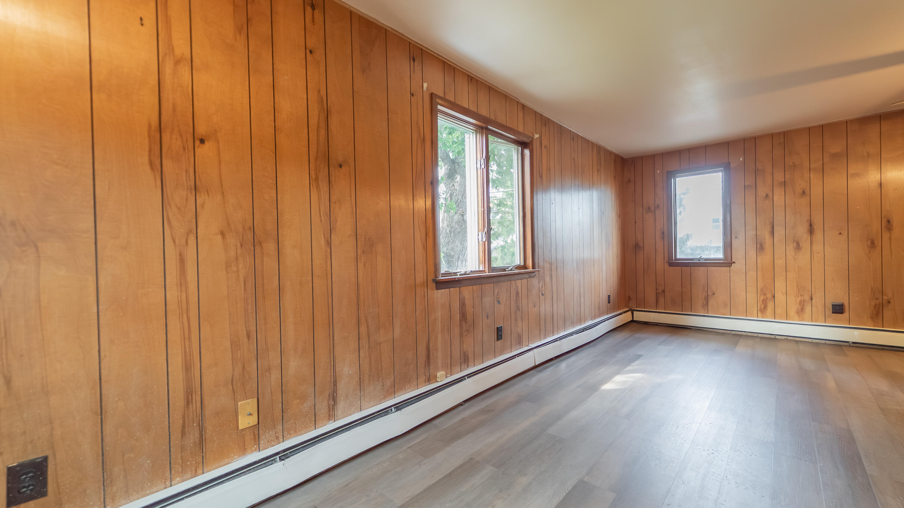 1916 Wespark Avenue Whiting, IN 46394 - Photo 16 of 32 an empty room with wooden floor and windows